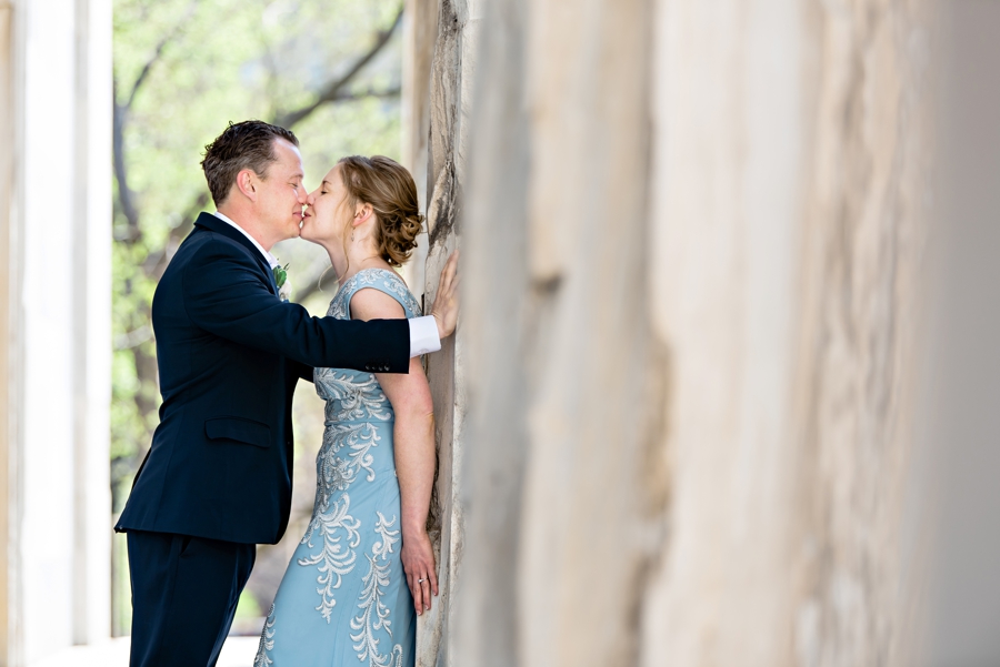 A groom kissing his bride at the second bank of America in Philadelphia.